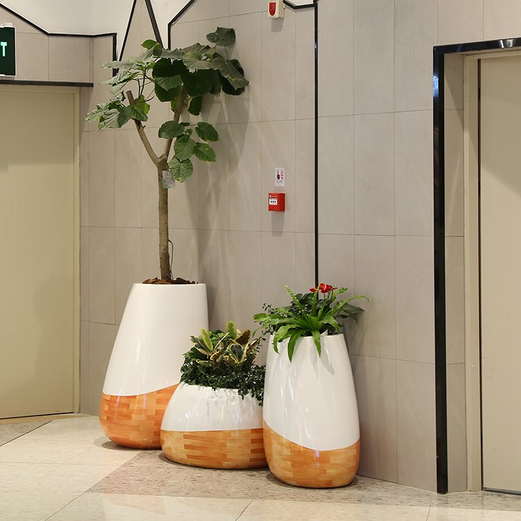 Creative wood-grain fiberglass planter set with unique shapes for shopping malls