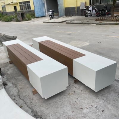 UHPC outdoor bench with a long wooden seat surface and GRC concrete base