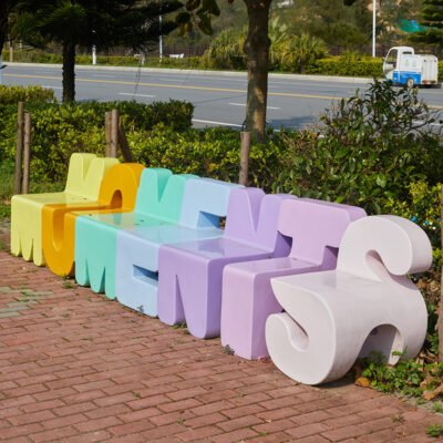 Creative Fiberglass Letter-Shaped Seating with Artistic Backrest